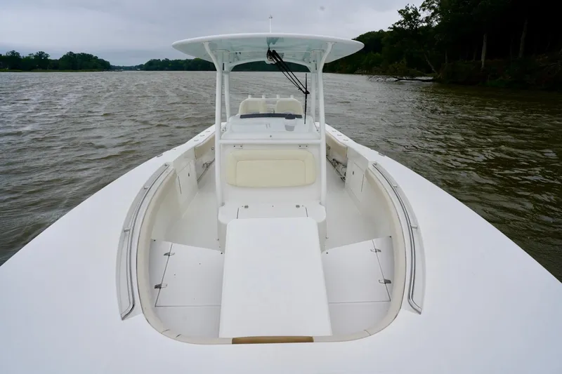  Yacht Photos Pics 2015 Southport 29 FE boat on calm water, showcasing spacious deck and seating.