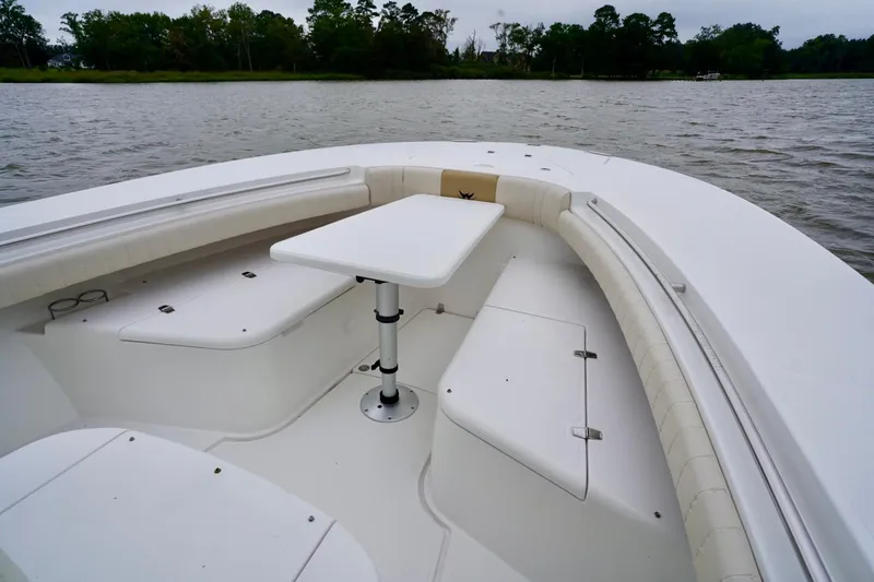  Yacht Photos Pics 2015 Southport 29 FE boat interior with seating and table on calm water.