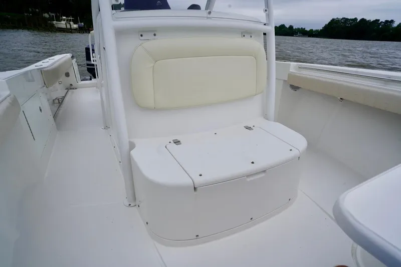 Yacht Photos Pics 2015 Southport 29 FE boat interior with cushioned seating and storage.