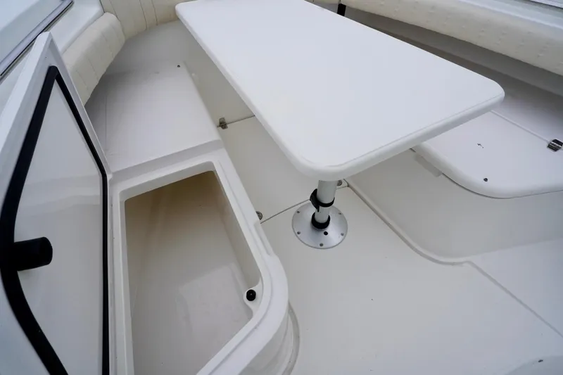  Yacht Photos Pics 2015 Southport 29 FE boat interior with storage compartment and table.