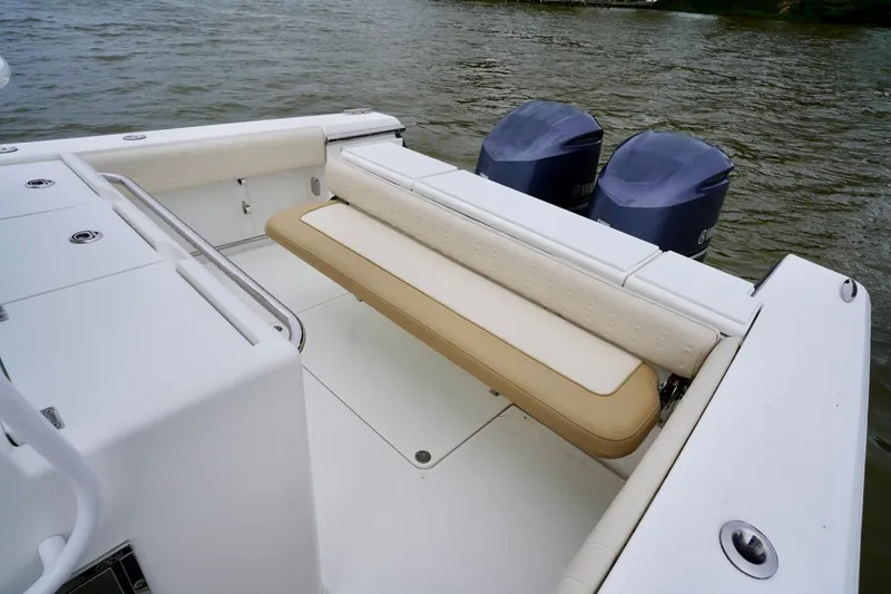  Yacht Photos Pics 2015 Southport 29 FE boat with dual engines and cushioned seating on the water.