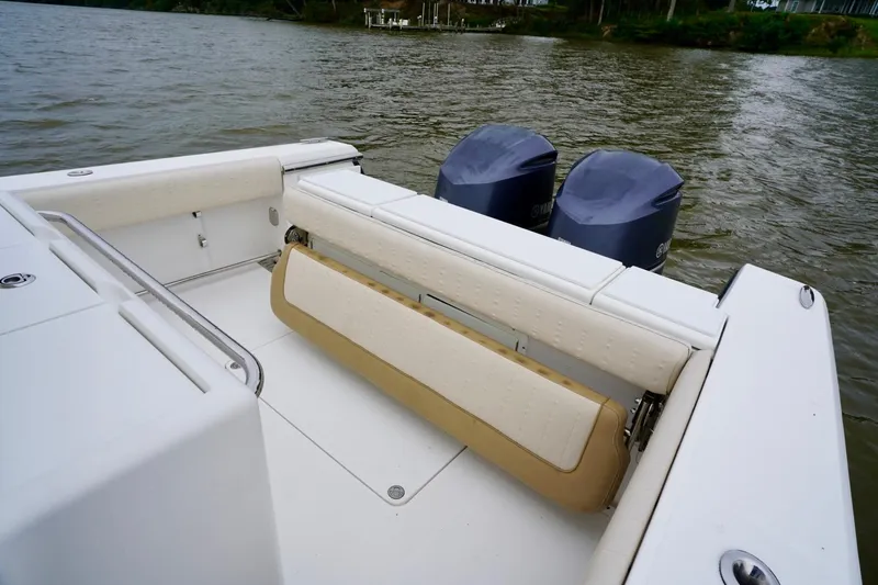  Yacht Photos Pics 2015 Southport 29 FE boat with dual engines and foldable seating on a calm waterway.