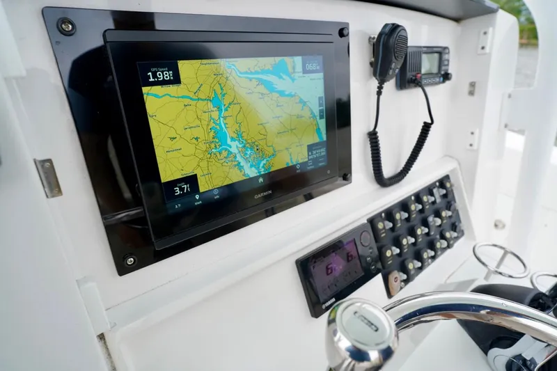  Yacht Photos Pics Control panel of 2015 Southport 29 FE boat with navigation display and radio.
