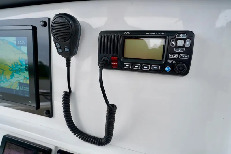  Yacht Photos Pics Control panel of 2015 Southport 29 FE boat with VHF marine radio and display screen.