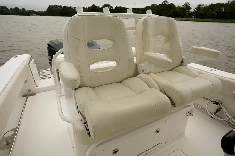  Yacht Photos Pics Luxurious seating on 2015 Southport 29 FE boat, featuring plush white leather chairs.