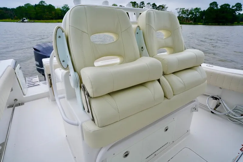  Yacht Photos Pics Luxurious seating on a 2015 Southport 29 FE boat, featuring plush white upholstery.