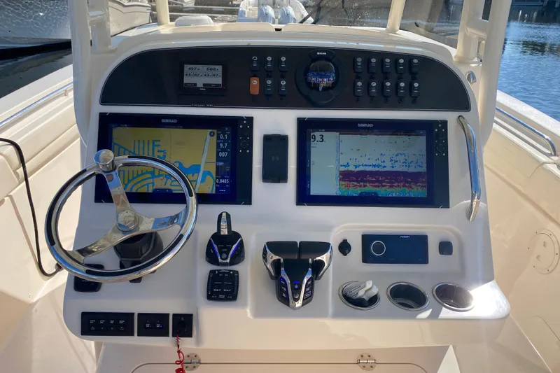  Yacht Photos Pics 2024 Grady-White Canyon 306 helm with advanced navigation and control systems.