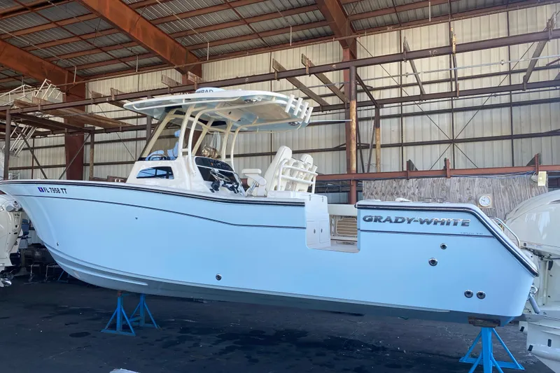  Yacht Photos Pics 2024 Grady-White Canyon 306 boat in a warehouse, side view.