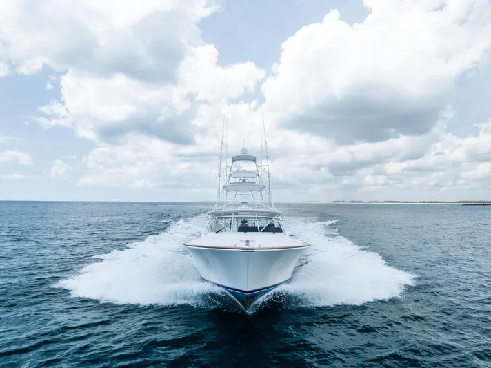 Ohayo Yacht Photos Pics Viking 52 Open yacht cruising on open sea under cloudy sky, 2010 model.