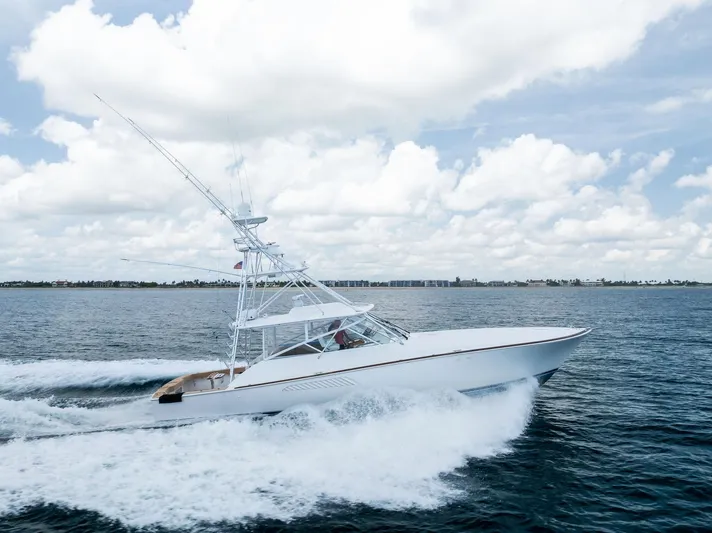 Ohayo Yacht Photos Pics 2010 Viking 52 Open yacht cruising on the ocean under a cloudy sky.