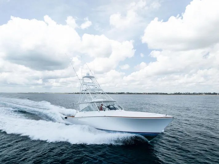 Ohayo Yacht Photos Pics 2010 Viking 52 Open yacht cruising on open water under a cloudy sky.