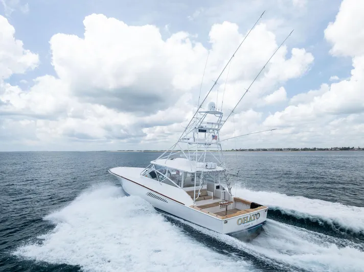 Ohayo Yacht Photos Pics 2010 Viking 52 Open yacht cruising on open water under cloudy skies.