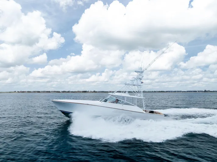 Ohayo Yacht Photos Pics 2010 Viking 52 Open yacht cruising on open water under a cloudy sky.