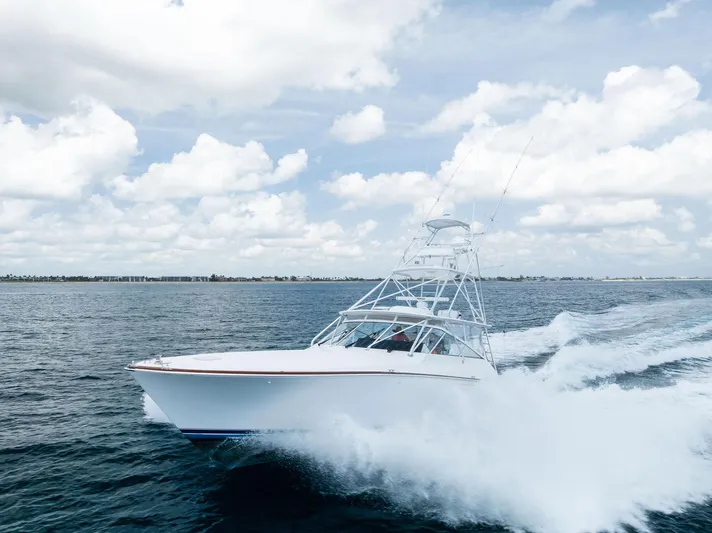 Ohayo Yacht Photos Pics 2010 Viking 52 Open yacht cruising on open water under a cloudy sky.