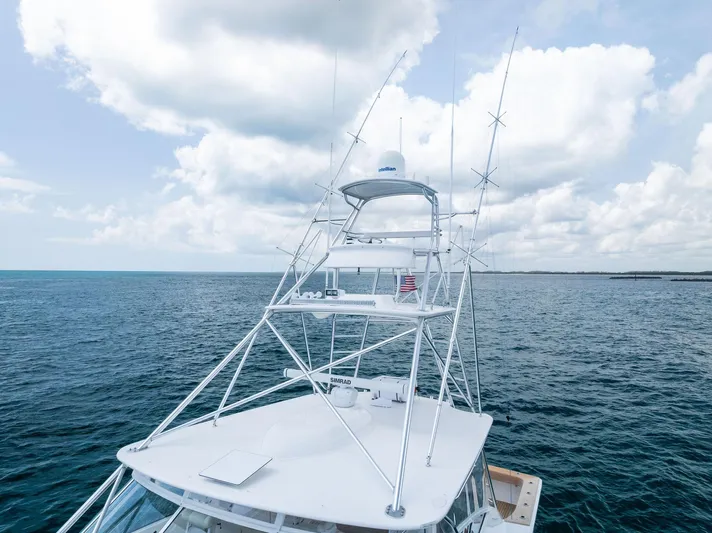 Ohayo Yacht Photos Pics 2010 Viking 52 Open yacht on open sea under cloudy sky.