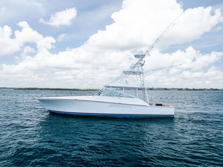 Ohayo Yacht Photos Pics 2010 Viking 52 Open yacht on calm ocean under cloudy sky.