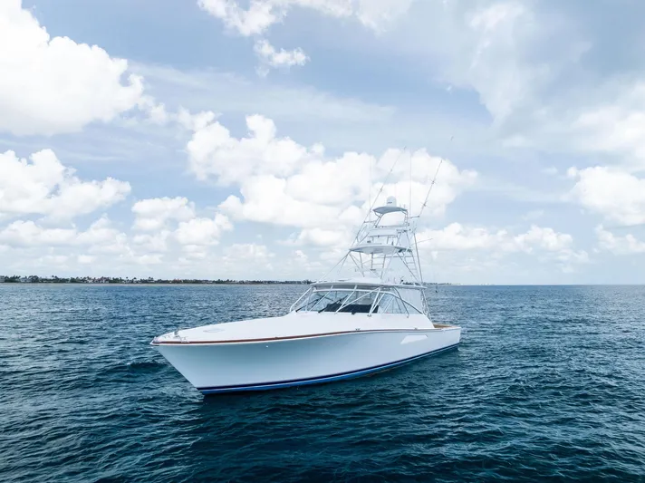 Ohayo Yacht Photos Pics 2010 Viking 52 Open yacht on calm ocean under cloudy sky.