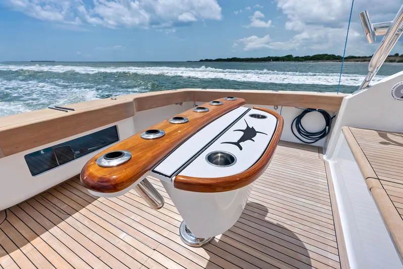 Ohayo Yacht Photos Pics 2010 Viking 52 Open yacht deck with fishing rod holders, ocean view.