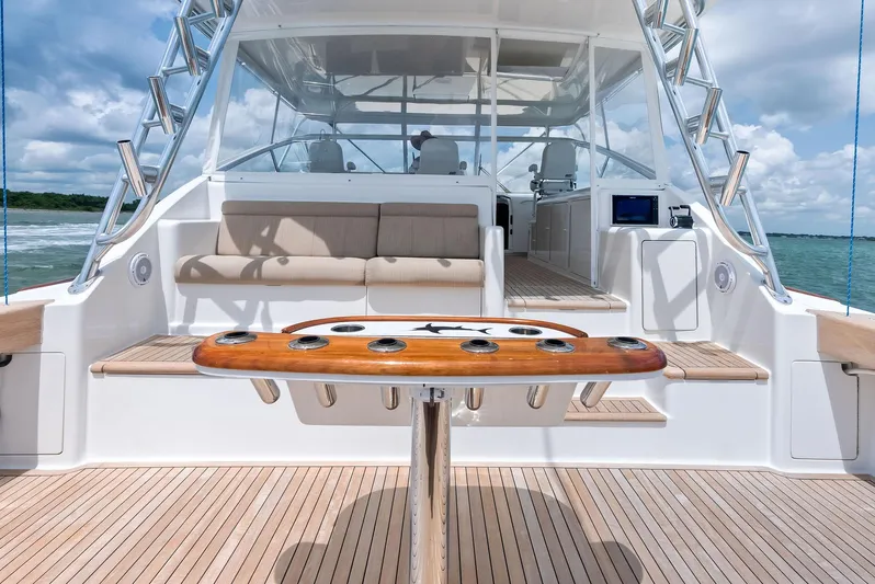 Ohayo Yacht Photos Pics 2010 Viking 52 Open yacht deck with seating and fishing rod holders.