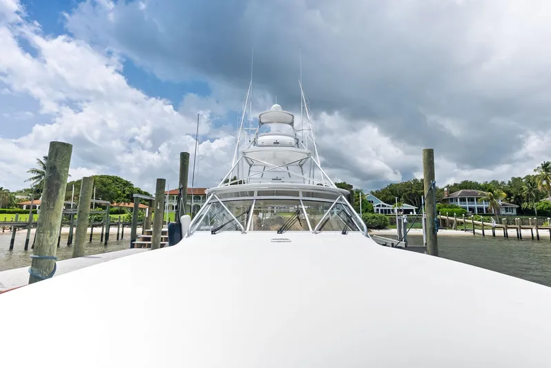 Ohayo Yacht Photos Pics 2010 Viking 52 Open yacht docked under cloudy sky.