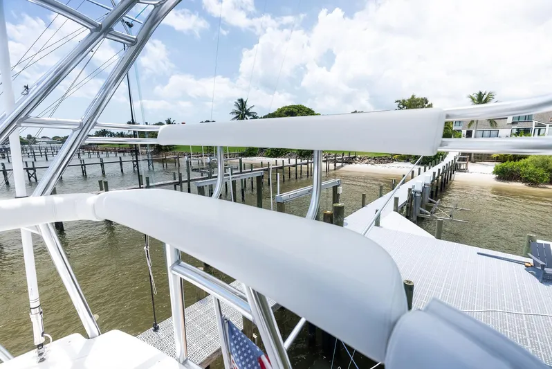 Ohayo Yacht Photos Pics 2010 Viking 52 Open yacht docked by a scenic waterfront.