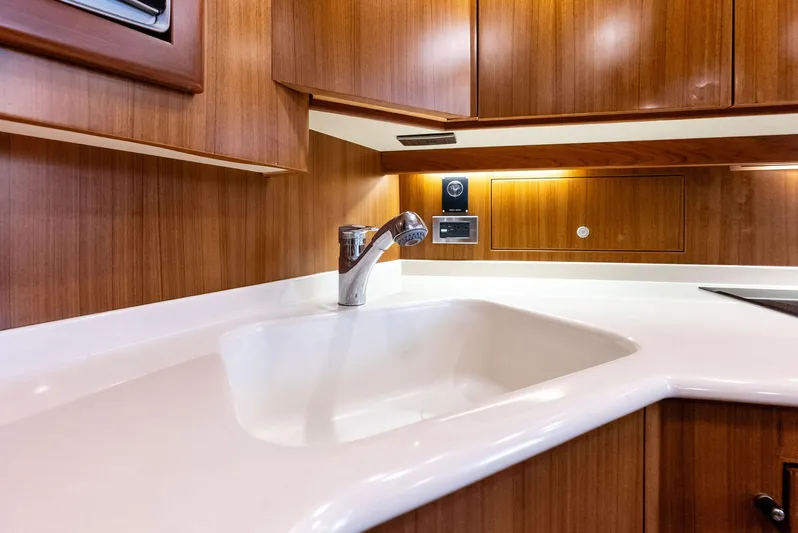 Ohayo Yacht Photos Pics Luxurious kitchen sink area in 2010 Viking 52 Open yacht.