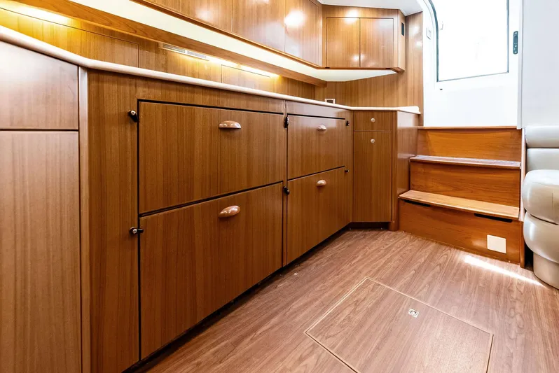 Ohayo Yacht Photos Pics Interior of 2010 Viking 52 Open yacht with wooden cabinetry and steps.