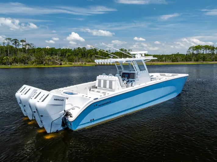  Yacht Photos Pics 2024 Invincible 37 Catamaran with triple Mercury engines on calm water.