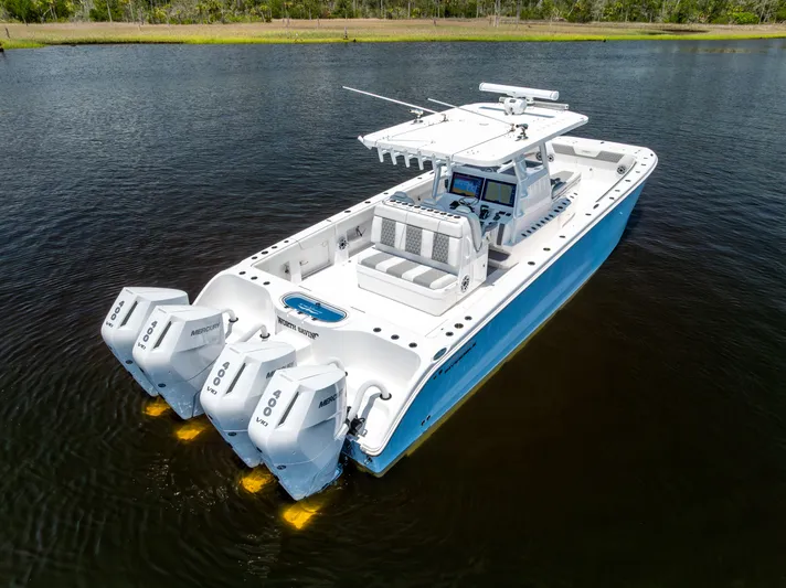  Yacht Photos Pics 2024 Invincible 37 Catamaran with triple Mercury engines on calm water.