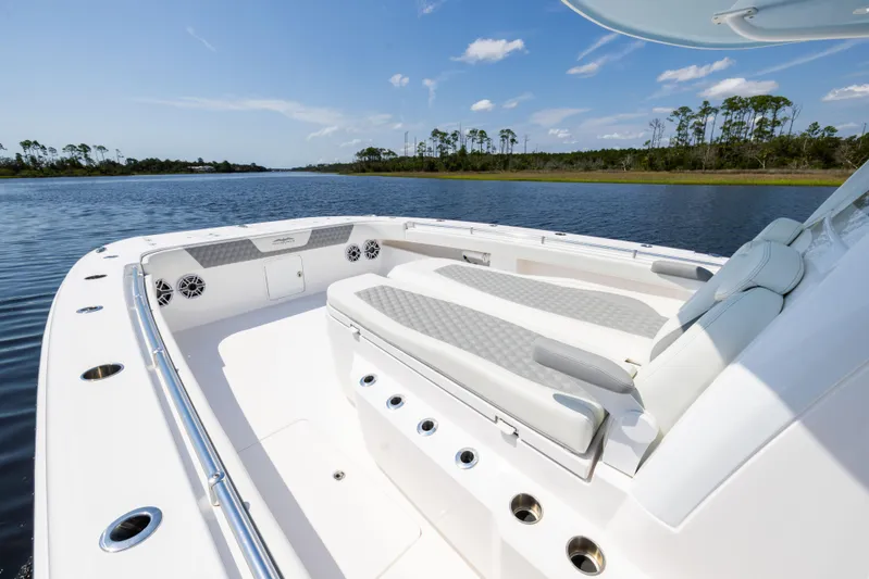  Yacht Photos Pics 2024 Invincible 37 Catamaran with spacious seating on calm waters.