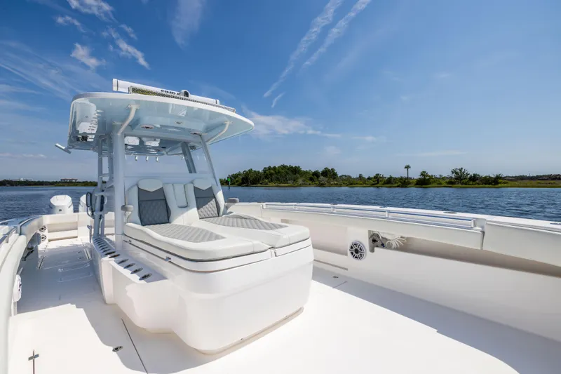  Yacht Photos Pics 2024 Invincible 37 Catamaran on water, featuring sleek design and spacious deck.