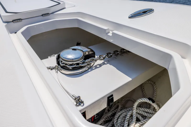  Yacht Photos Pics Anchor storage compartment on 2024 Invincible 37 Catamaran, featuring chain and rope.