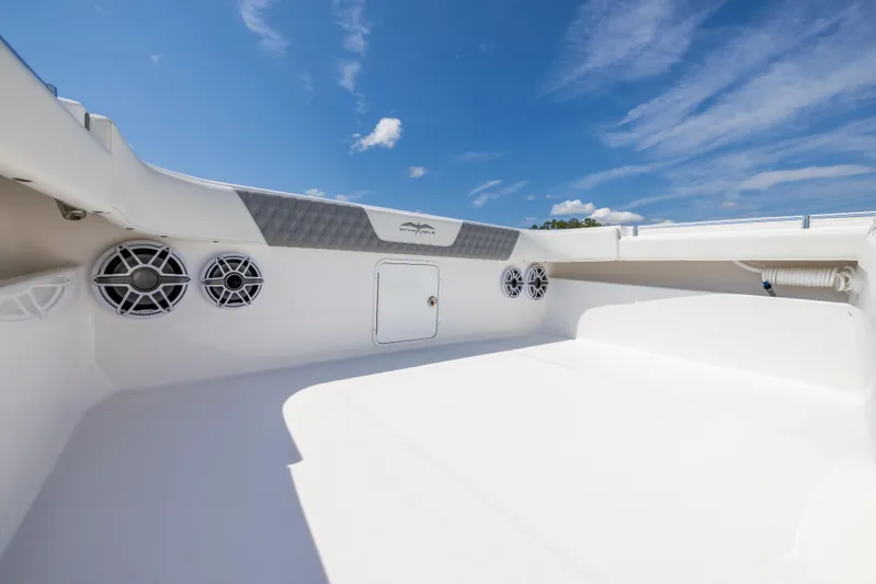  Yacht Photos Pics 2024 Invincible 37 Catamaran deck with speakers under a clear blue sky.