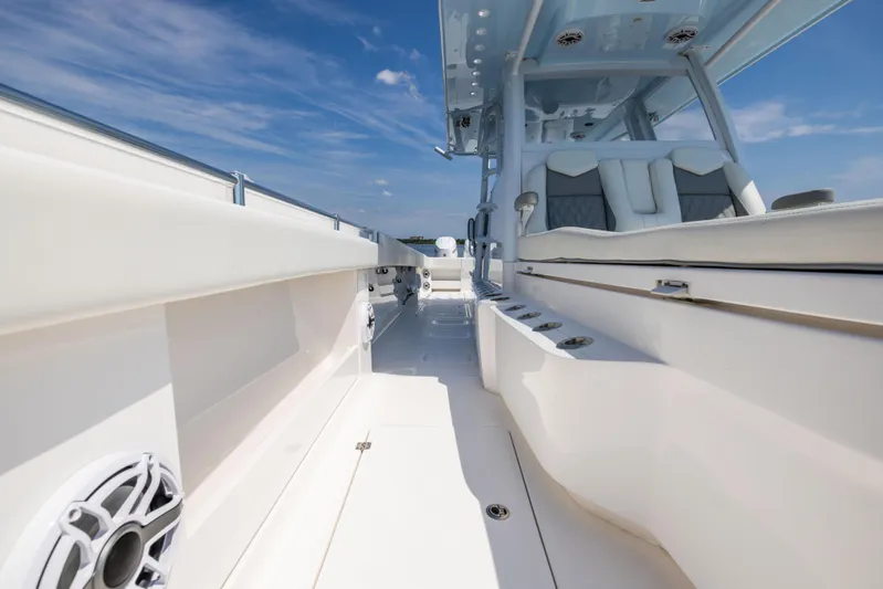  Yacht Photos Pics 2024 Invincible 37 Catamaran interior with sleek seating and modern design under a clear sky.