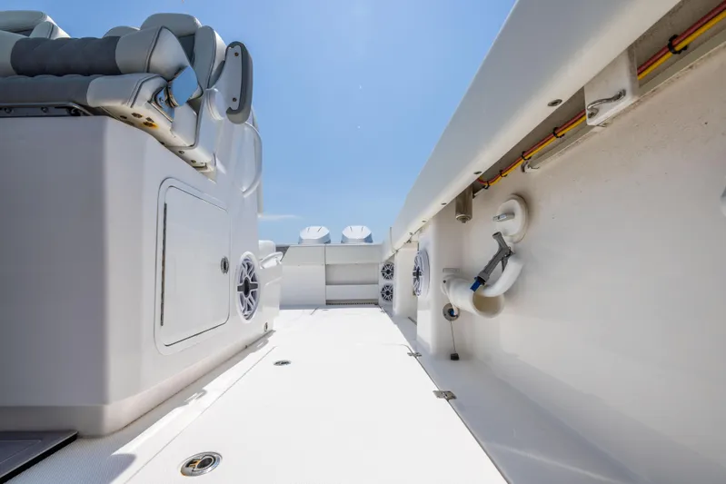  Yacht Photos Pics 2024 Invincible 37 Catamaran interior, showcasing sleek design and modern features under a clear sky.