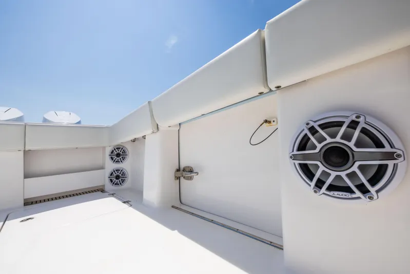  Yacht Photos Pics 2024 Invincible 37 Catamaran with JL Audio speakers, white interior, and clear blue sky.