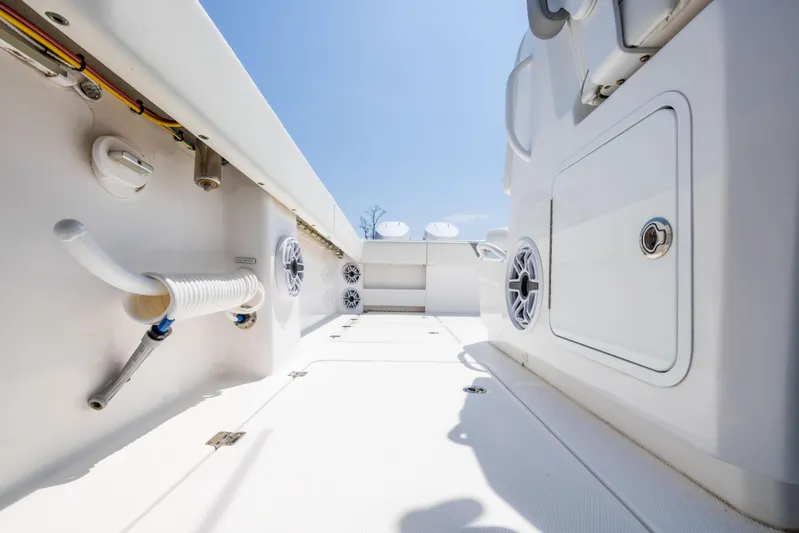  Yacht Photos Pics 2024 Invincible 37 Catamaran interior, showcasing sleek white design and modern features.