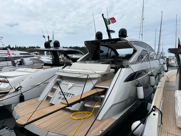  Yacht Photos Pics Luxury Filippetti S55 yacht docked, showcasing sleek design and modern features, 2025 model.