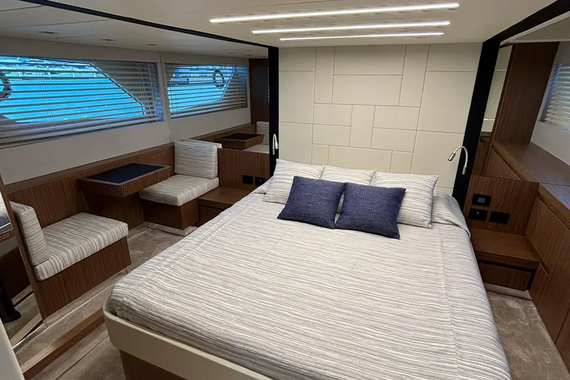  Yacht Photos Pics Luxurious cabin interior of 2025 Filippetti S55 yacht with modern design and comfortable bedding.