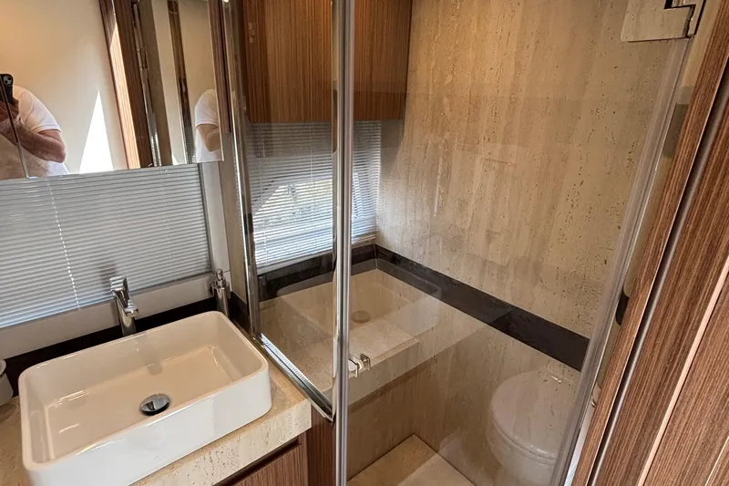  Yacht Photos Pics Luxurious bathroom interior of 2025 Filippetti S55 yacht with modern sink and shower.