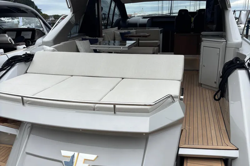  Yacht Photos Pics Luxury 2025 Filippetti S55 yacht with spacious deck and elegant interior seating.