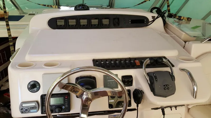 The Office Yacht Photos Pics 2007 Grady-White Express 360 helm with steering wheel and control panel.