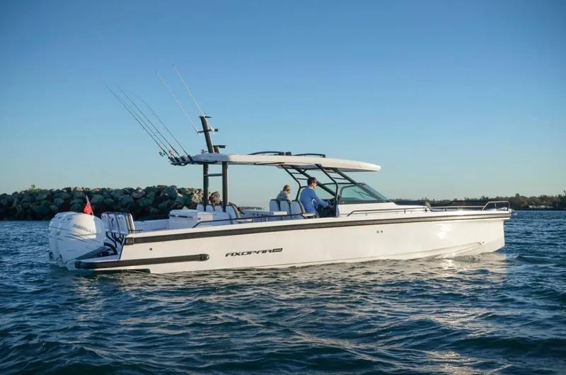  Yacht Photos Pics 2025 Axopar 37 Sun Top BRABUS Trim boat cruising on calm waters.