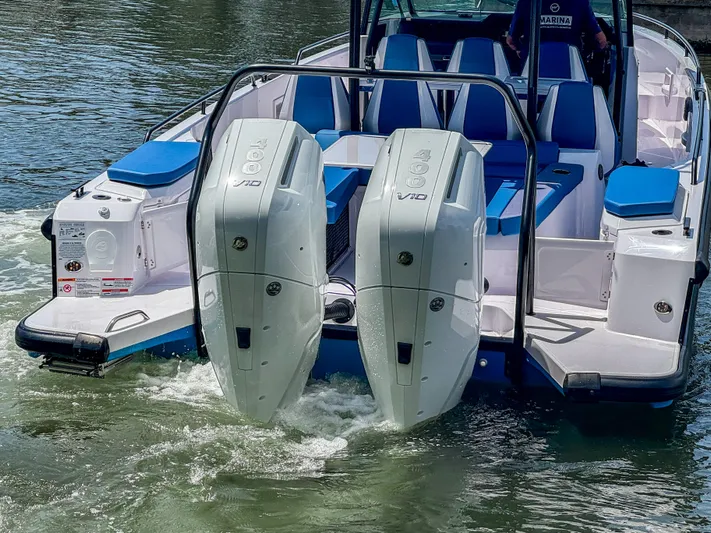  Yacht Photos Pics 2025 Axopar 37 Sun Top BRABUS Trim with dual outboard engines on water.