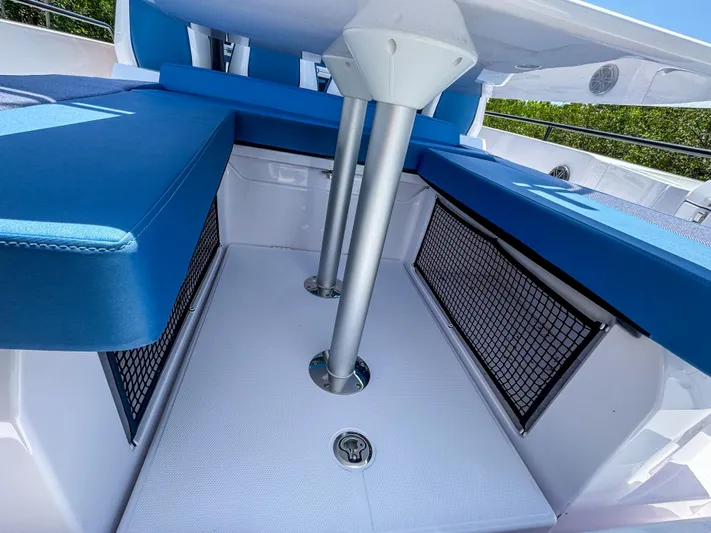  Yacht Photos Pics 2025 Axopar 37 Sun Top BRABUS Trim interior with blue seating and storage nets.