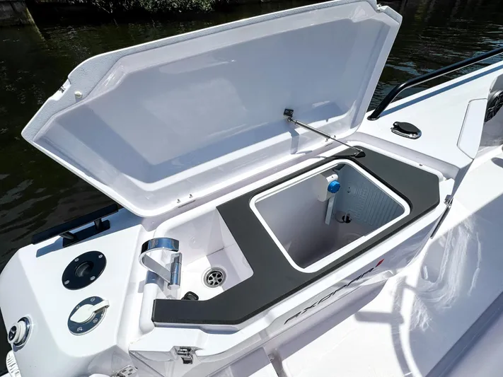  Yacht Photos Pics 2025 Axopar 37 Sun Top BRABUS Trim boat with open storage compartment.