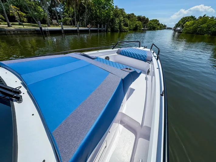  Yacht Photos Pics 2025 Axopar 37 Sun Top BRABUS Trim boat on a serene waterway.