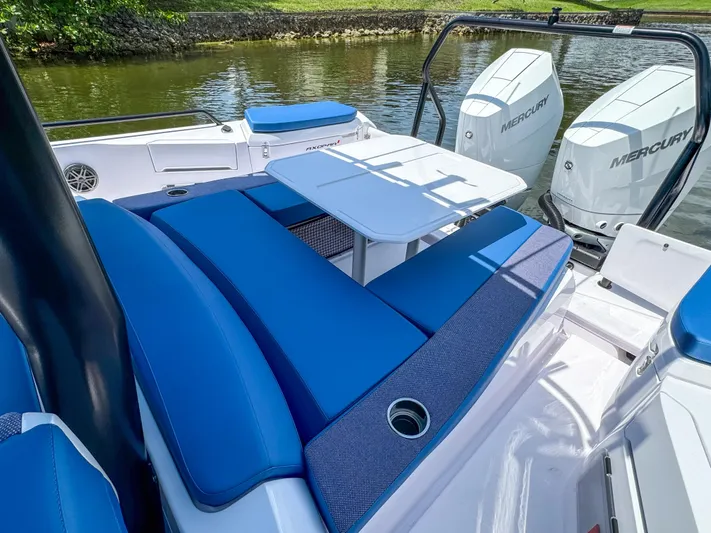  Yacht Photos Pics 2025 Axopar 37 Sun Top BRABUS Trim with blue seating and dual Mercury engines.