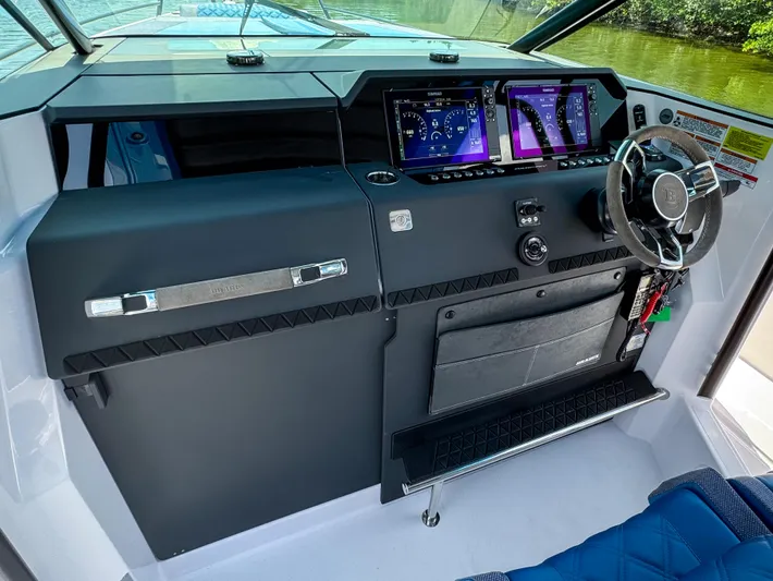  Yacht Photos Pics 2025 Axopar 37 Sun Top BRABUS Trim dashboard with advanced controls and steering wheel.