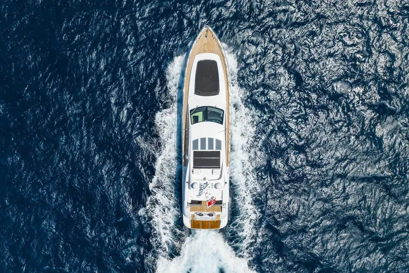 MilÙ II Yacht Photos Pics Overhead view of 2009 Overmarine Mangusta 80 yacht cruising on open sea.